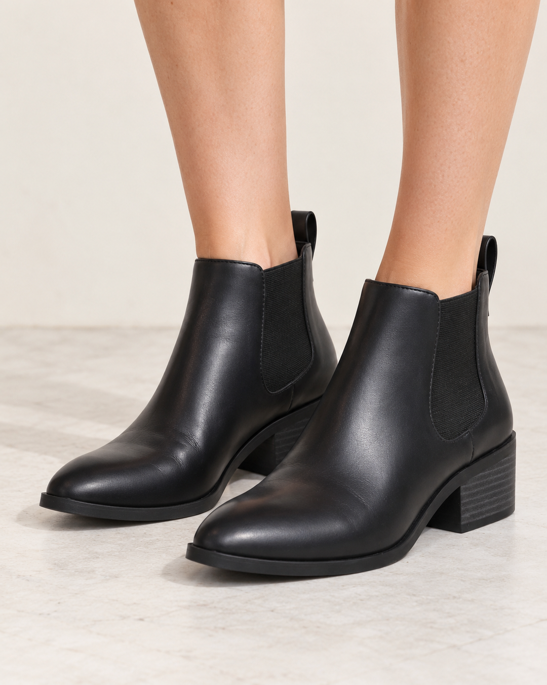 BC Footwear Partner black Chelsea ankle boots, front three-quarter view showing elastic panels and stacked heels.