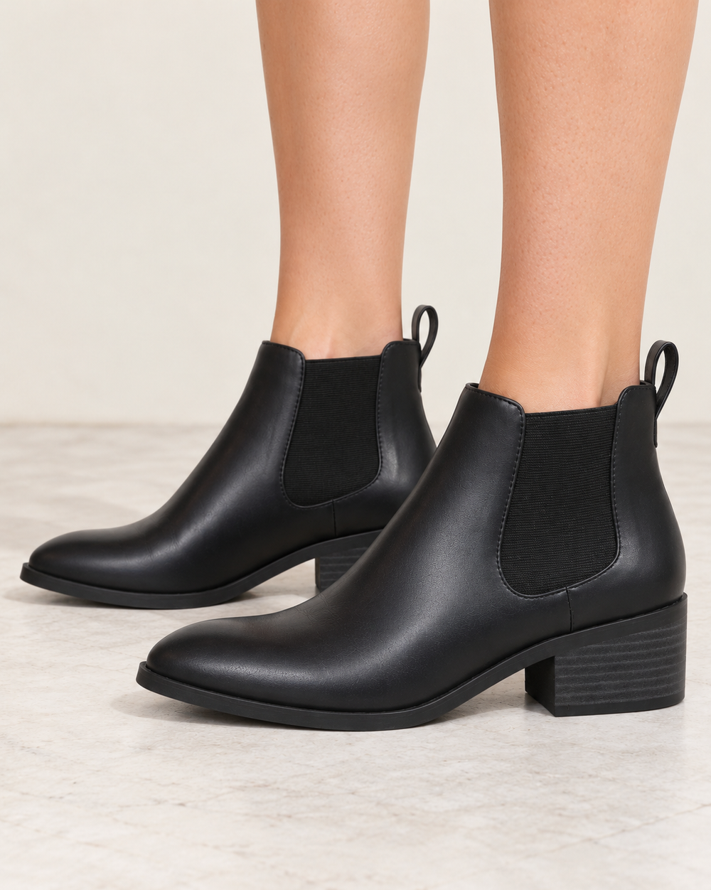 BC Footwear Partner black Chelsea ankle boots, side view showing the elastic gusset and ankle-height profile.