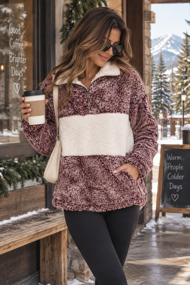 Women's burgundy and ivory colorblock sherpa half-zip pullover with plush texture and front kangaroo pocket styled with black leggings