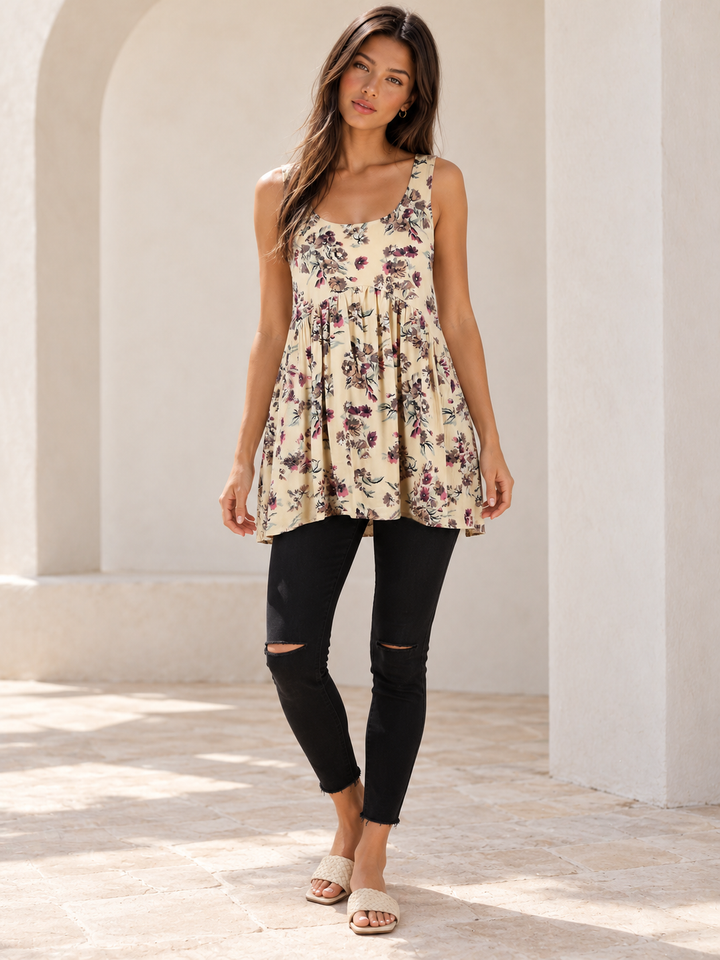 Delightful yellow floral tunic styled with Bella black skinny jeans and Fiona bone woven slides.
