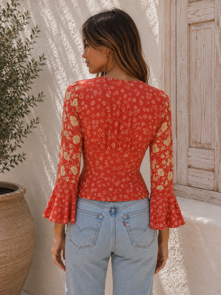 back view of the Lady Bohemian Floral Button Front Blouse styled with light wash denim jeans.