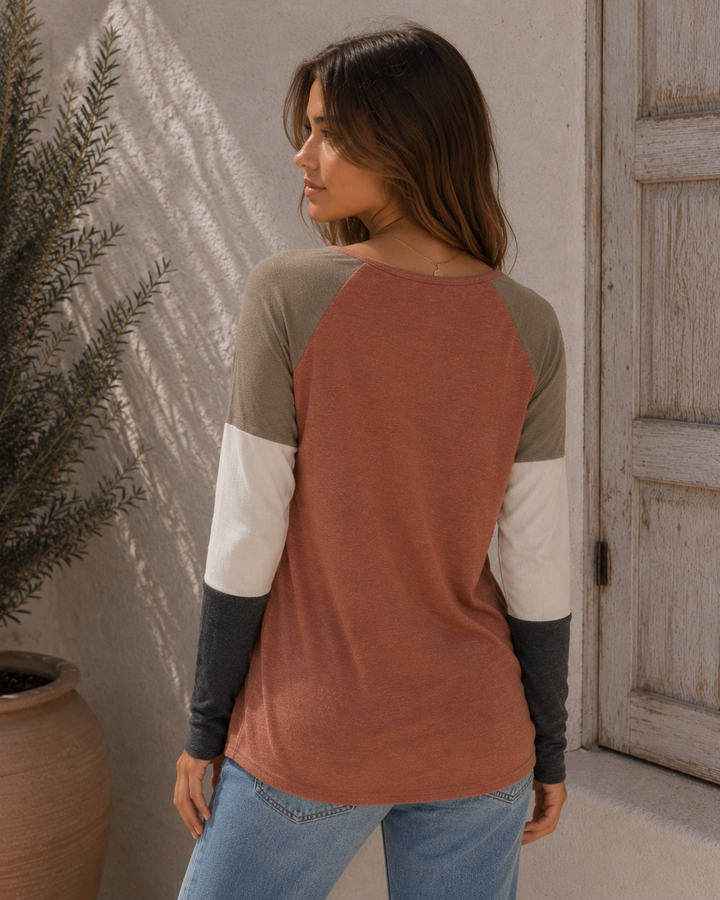 Back view of the cinnamon colorblock raglan top with olive, ivory, and charcoal sleeves.