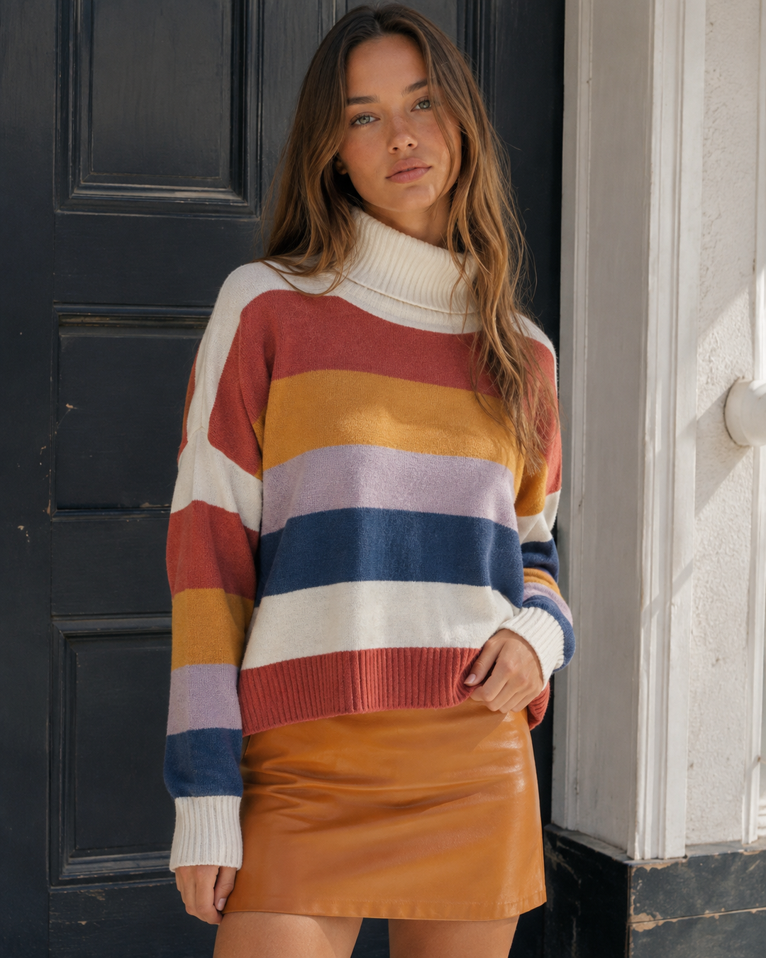 Front view of the MINKPINK Be Bold multicolor striped turtleneck knit sweater.