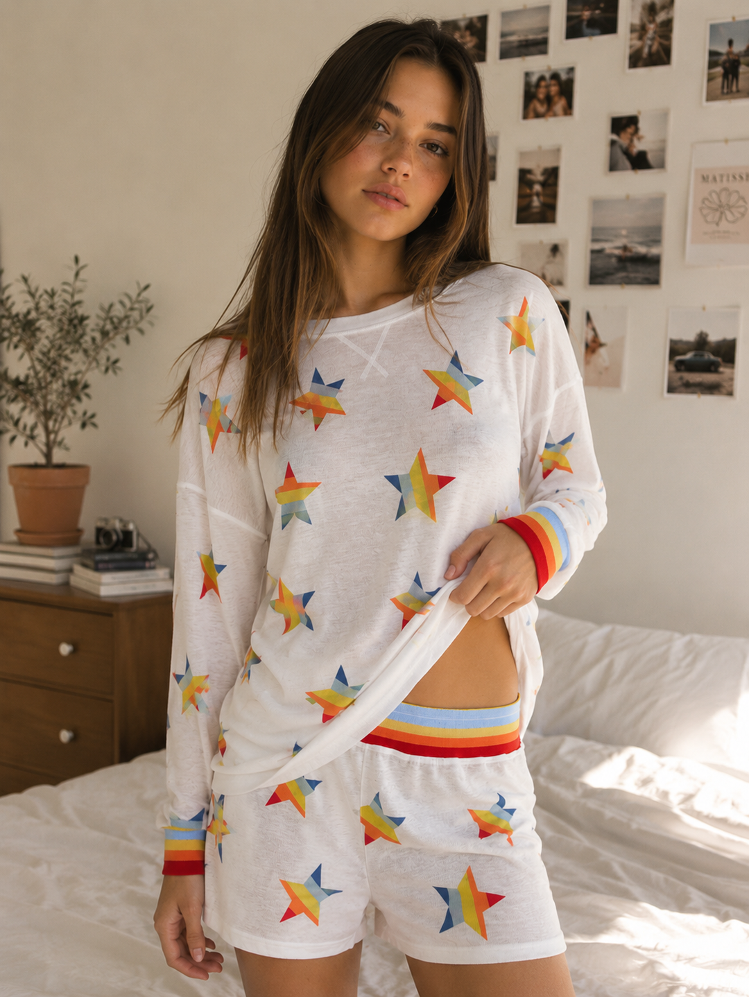 Front view of the Seeing Stars Rainbow Print Loungewear Set featuring a white long sleeve top and matching shorts with colorful star print.
