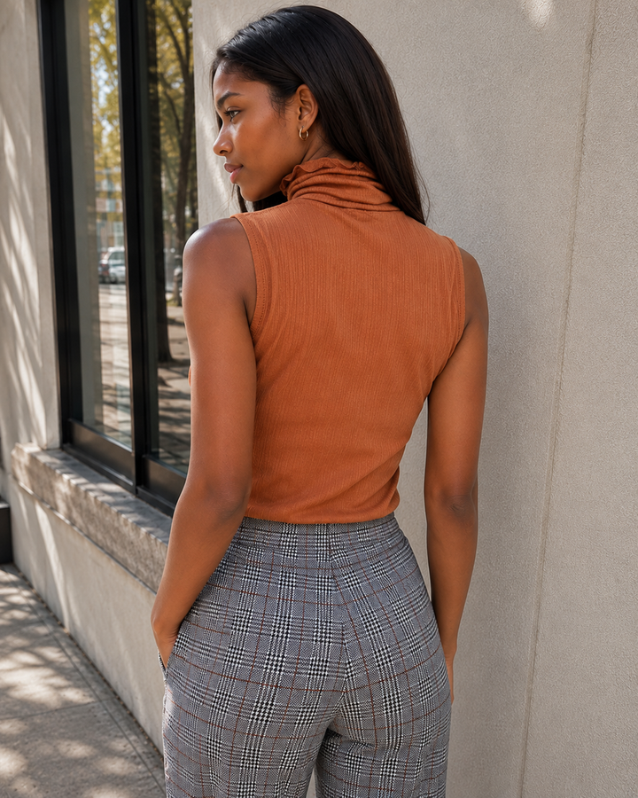Sleeveless ribbed turtleneck knit top in warm Gucci Tan, back view.