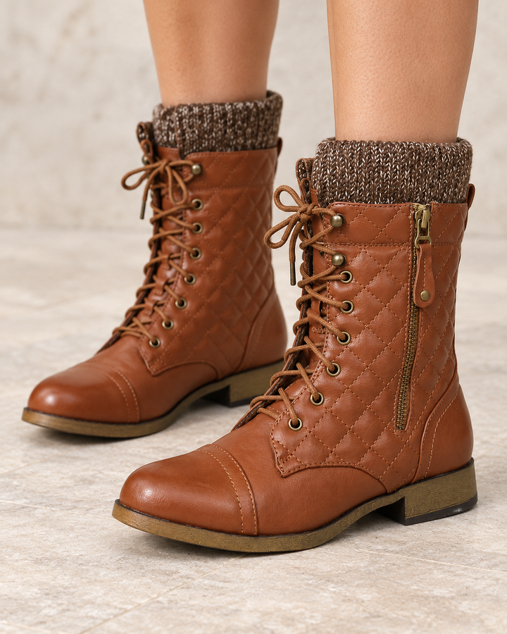 Alpine cognac quilted combat sweater boots worn on feet, front view #color_cognac
