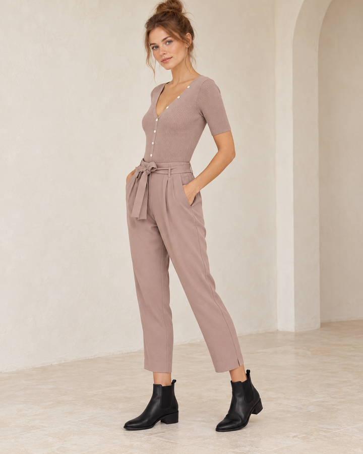 Wishlist Beatrice twig ribbed button-front bodysuit, side view on a model styled with mauve crepe pants and black Chelsea ankle boots. 