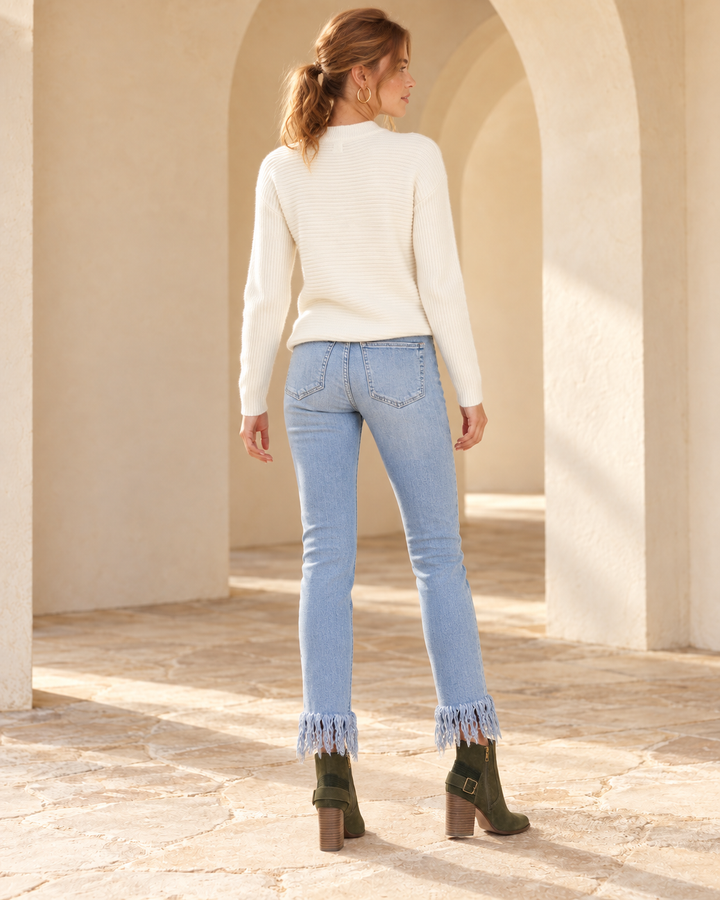 Back view of Free People - Great Heights Frayed Skinny Jeans in Regal Blue, styled with the catalog white top and matching footwear.