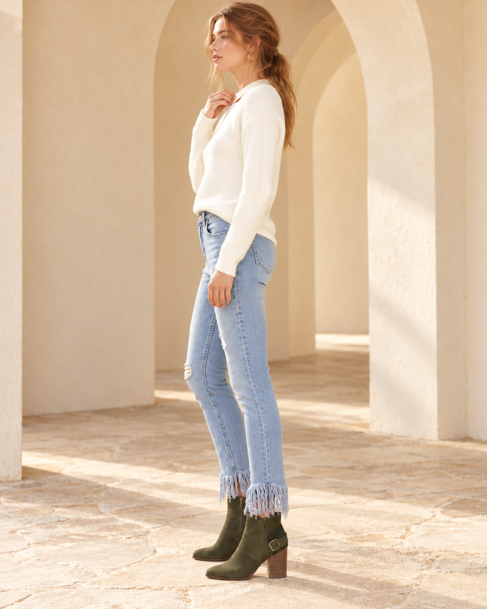 Side view of Free People - Great Heights Frayed Skinny Jeans in Regal Blue, styled with the catalog white top and matching footwear.