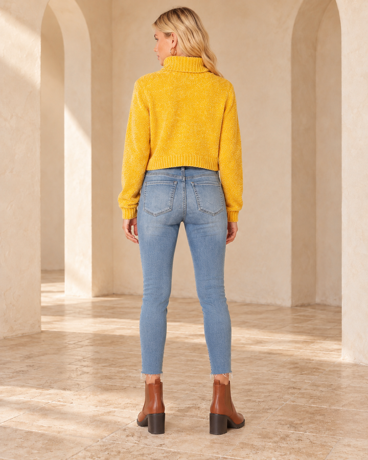 Back view of Free People - Reagan Button Front Jeans in Sky, styled with the catalog mustard top and matching footwear.