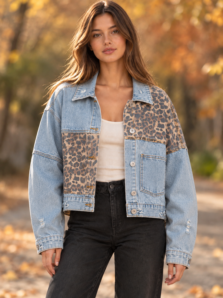 Front view of the Off Duty leopard denim jacket in light blue denim with asymmetric leopard panels.