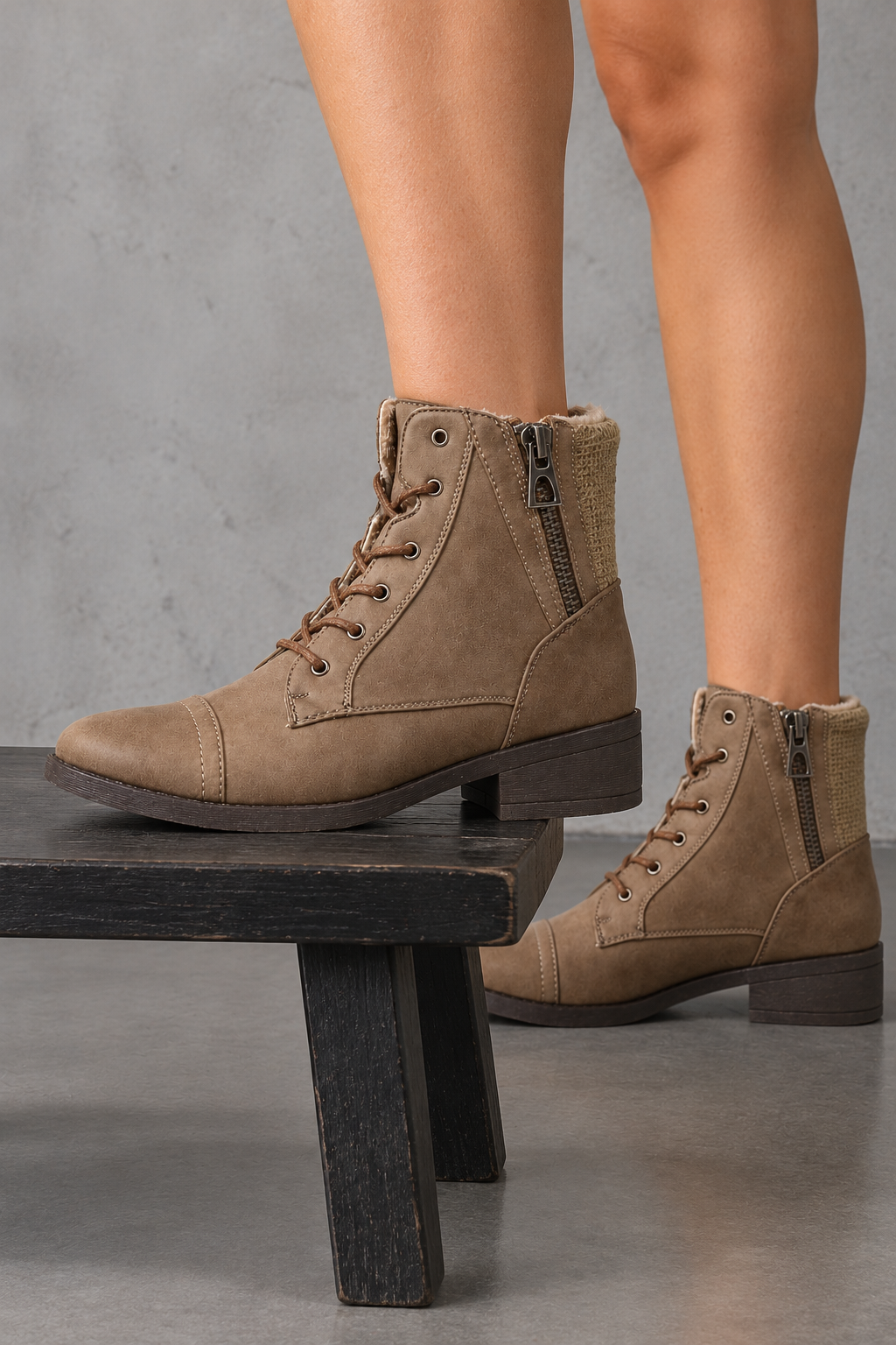 Brielle taupe lace-up ankle sweater booties with side zippers, side view worn on feet in a neutral studio.