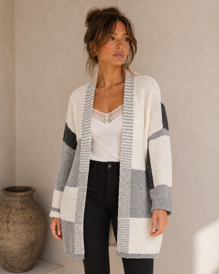 Closer view of the greyscale cardigan showing the knit texture, open front and complete hem.