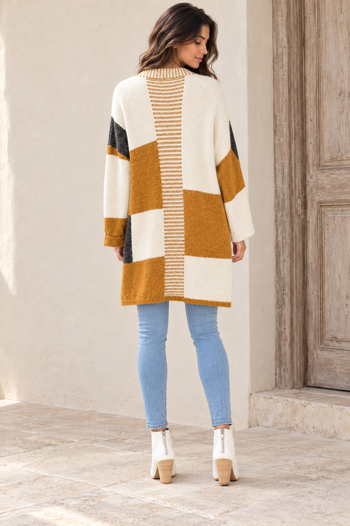 Back view of Long-Line Open-Front Mustard Color Block Cardigan on an adult model in warm natural light.
