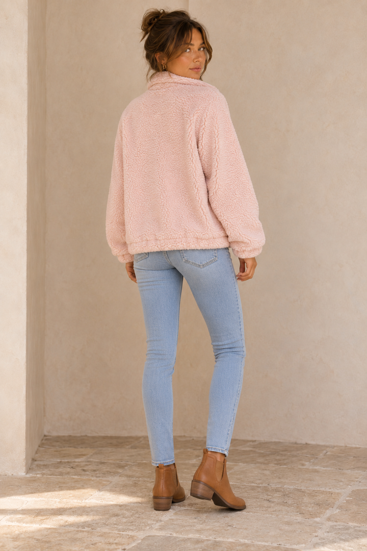 Back view of the Twig pale-pink zip-up teddy jacket showing the full back and dropped shoulders.