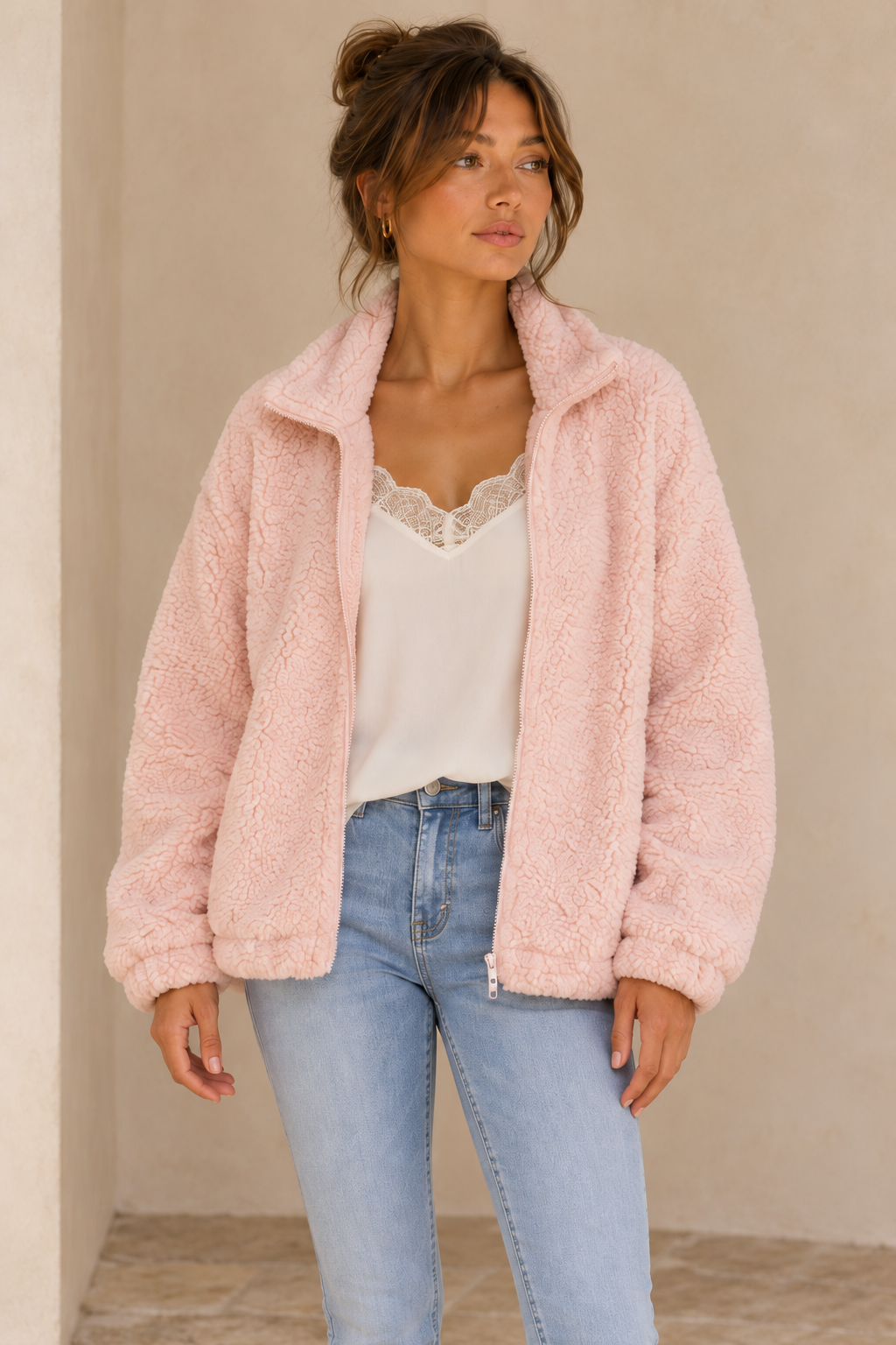 Closer view of the Twig pale-pink zip-up teddy jacket showing the collar, zipper and fuzzy teddy texture.