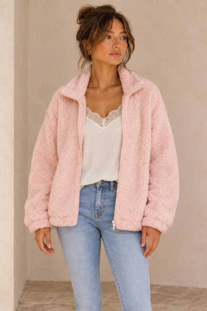 Closer view of the Twig pale-pink zip-up teddy jacket showing the collar, zipper and fuzzy teddy texture.