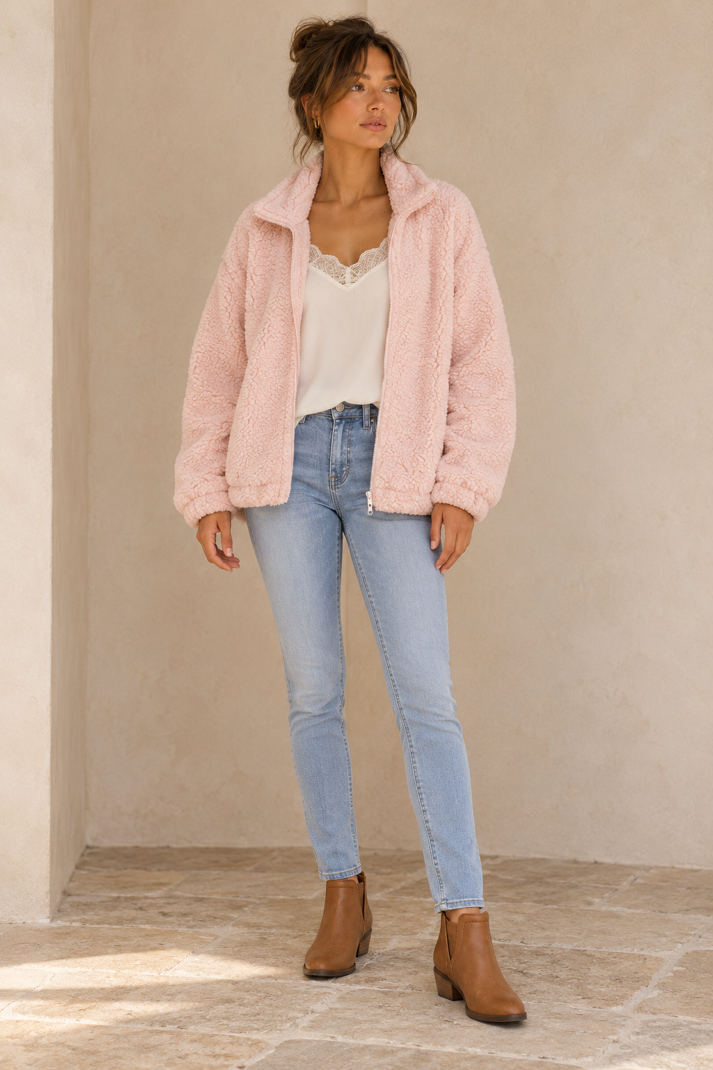 Front view of the Twig pale-pink zip-up teddy jacket showing the zip front and relaxed silhouette.