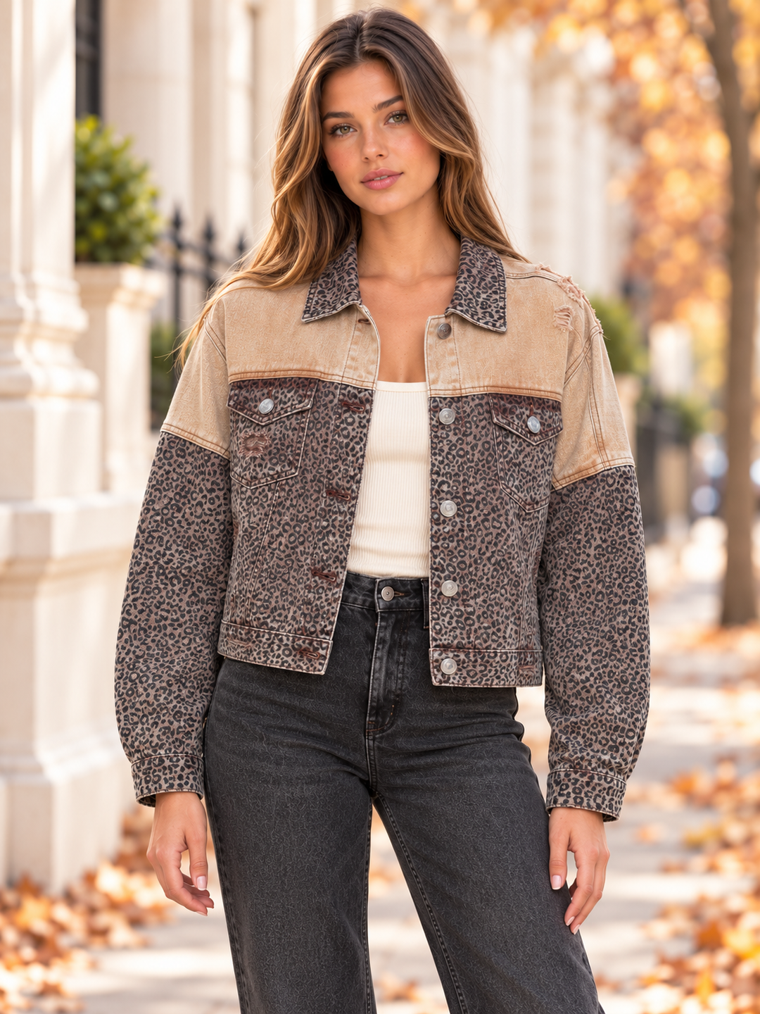 Front view of the caramel distressed leopard denim jacket with a contrasting tan yoke.