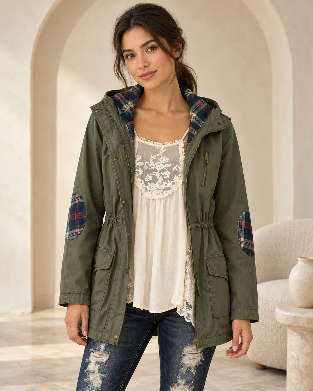 Olive hooded utility parka on an adult model, open-front view showing plaid hood lining and elbow patches.