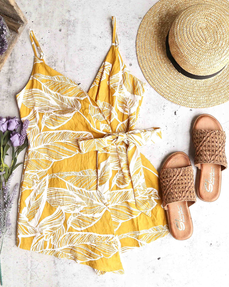 Dripping in Finesse Leaf Print Wrap Romper in Yellow
