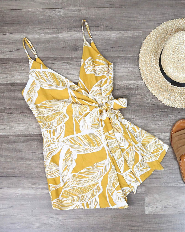Dripping in Finesse Leaf Print Wrap Romper in Yellow
